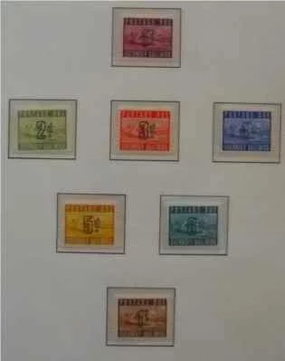 Hingeless Stamp Album showing some colorful Channel Islands stamps