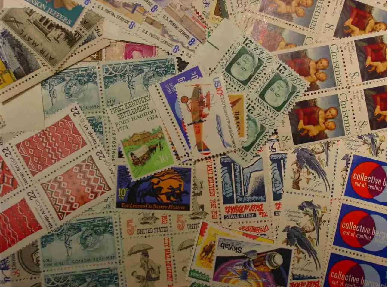US Postage - A pile of stamps in the 5 cent to 22 cent range that are most valuable when used as postage. So brighten up your mail and save some money!